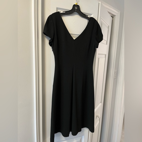 Black deep V neckline dress with gathering at waist. - Picture 2 of 3